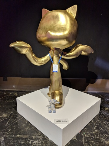 Blue Cow and a gold-coloured Octocat statue.