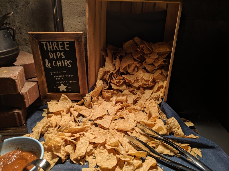 It is important for corn chips to spill out from a wooden crate, apparently.